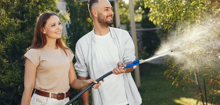 HydroBlast Power Nozzle used by a couple for gardening